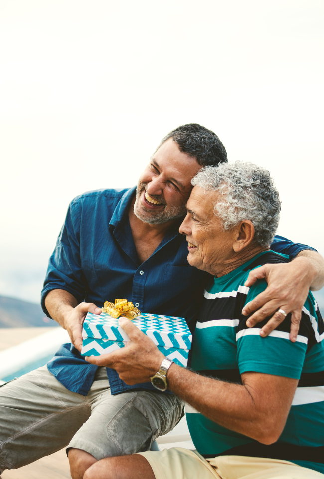 2 men exchanging a gift outside